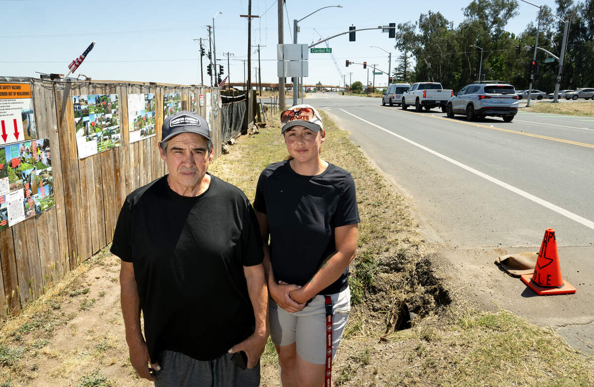 Robert Sandoval, left, and his daughter Melissa have been fighting county and city officials over flooding caused by construction errors in area of Roselle Ave and Claribel Road in Riverbank.